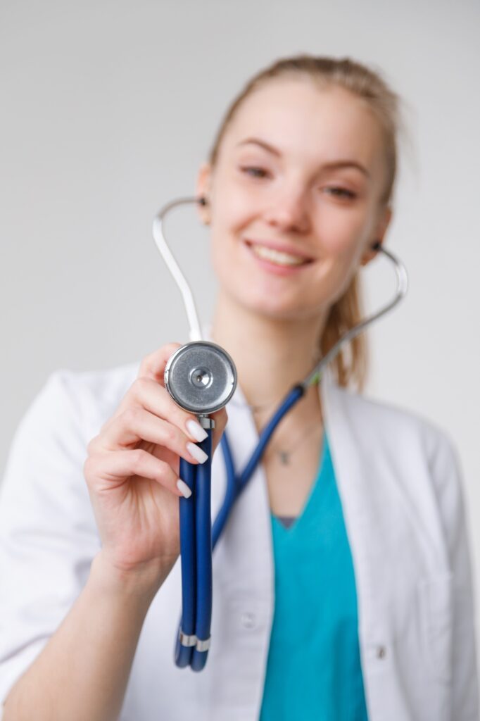 Closeup shot of stethoscope in female doctor hand ready to listen to breath.
