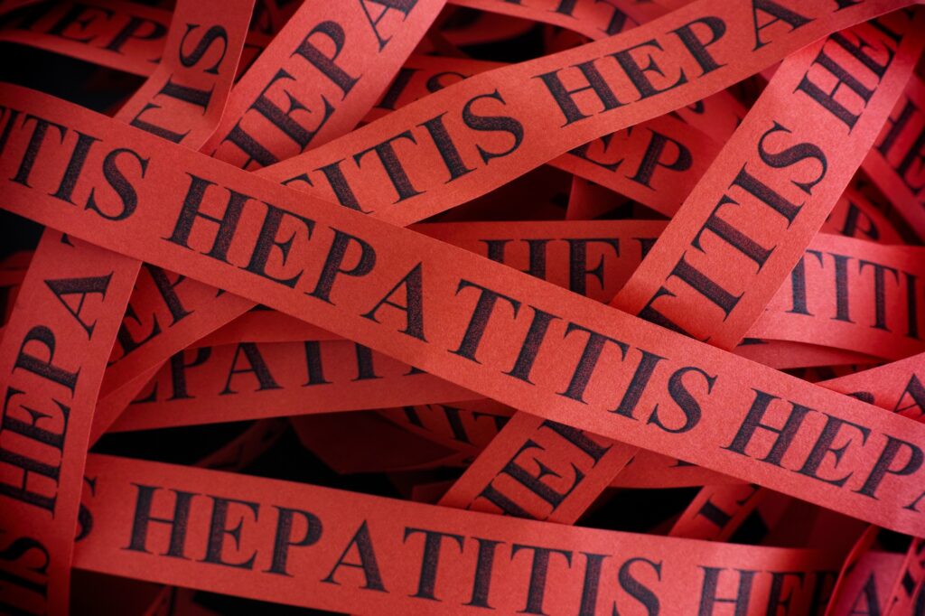 Hepatitis. Pieces of paper with the words Hepatitis